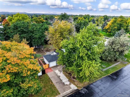 a view of a garden with a building in the background
