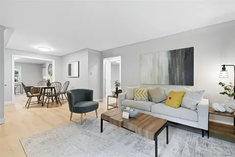 a living room with furniture and a rug