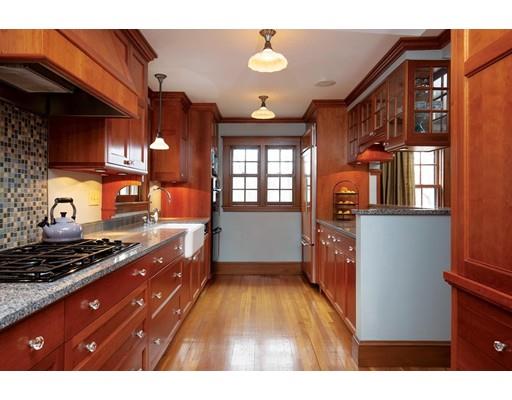 4 Tamworth Road Newton, MA 02468 - Photo 5 of 12 a kitchen with stainless steel appliances granite countertop a stove a sink dishwasher and cabinets with wooden floor