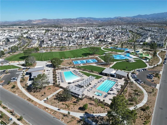 an aerial view of a residential houses with outdoor space