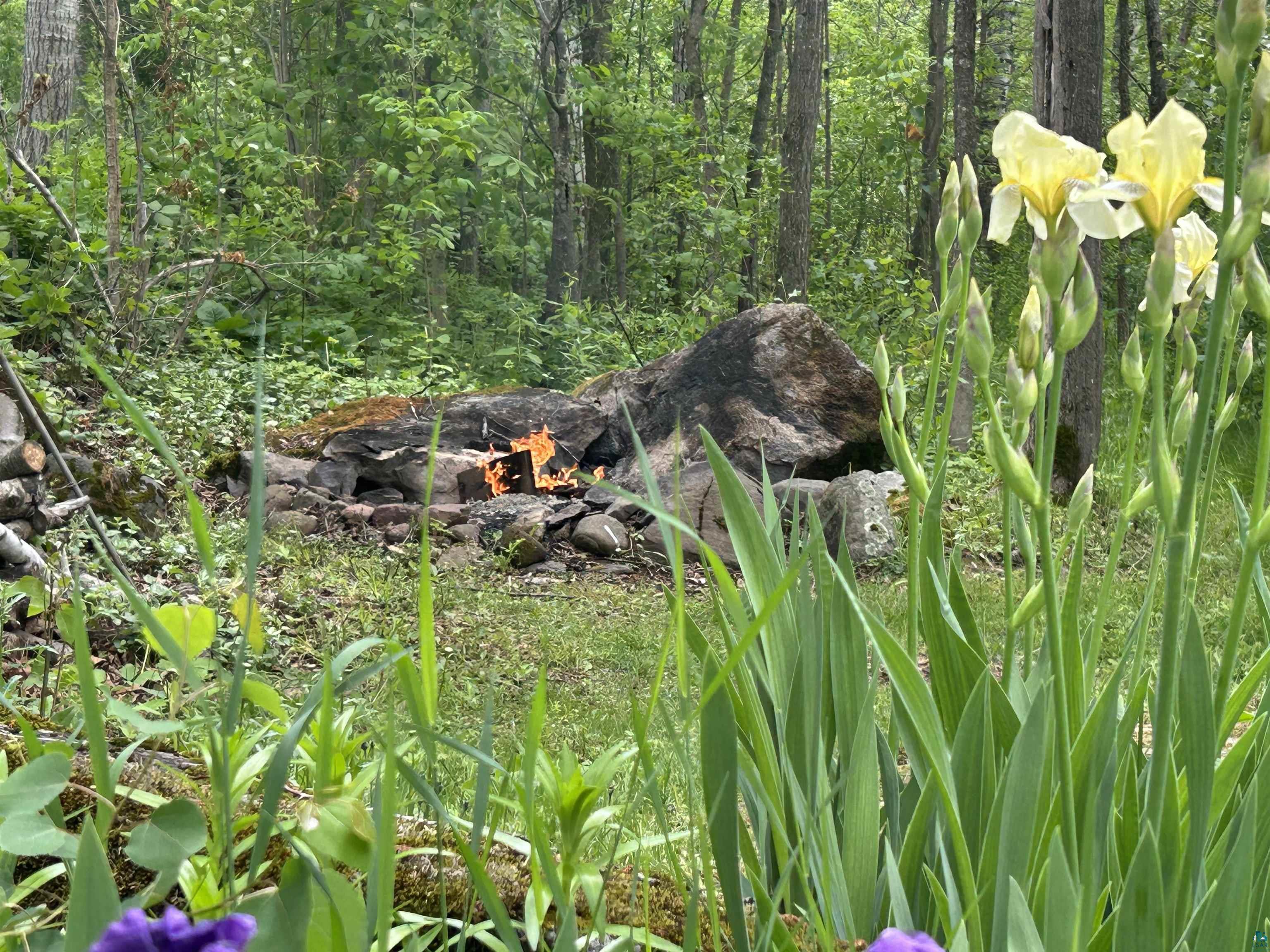 3616 Lavaque Road Hermantown, MN 55811 - Photo 8 of 43 Stone fire pit with natural rock surround