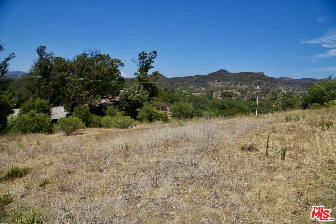 25755 Piuma Road Calabasas, CA 91302 - Photo 7 of 7 a view of a lake with mountain