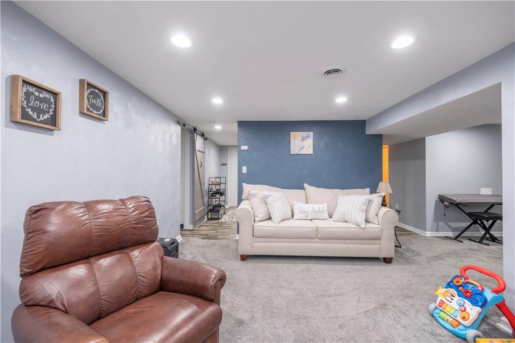 325 Clements Road Pittsburgh, PA 15239 - Photo 17 of 28 The first area has carpeting and recessed lighting