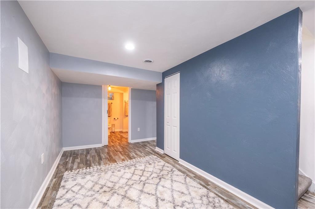 325 Clements Road Pittsburgh, PA 15239 - Photo 19 of 28 There is another finished spaced in the basement with LTV flooring that leads to the 2nd full bathroom and garage