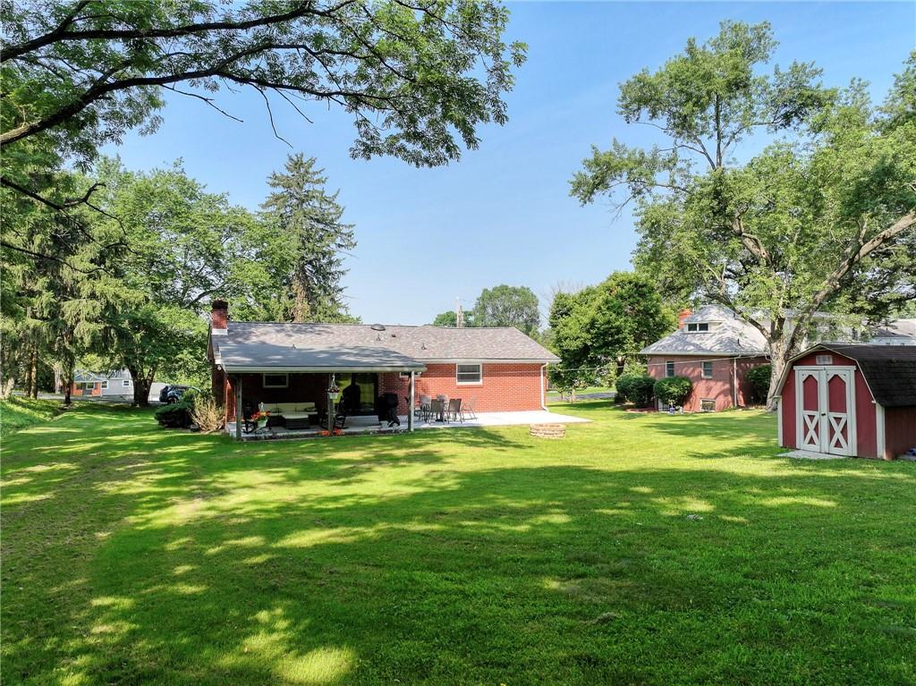 325 Clements Road Pittsburgh, PA 15239 - Photo 23 of 28 The back yard is surrounded by a tree line providing plenty of shade and privacy