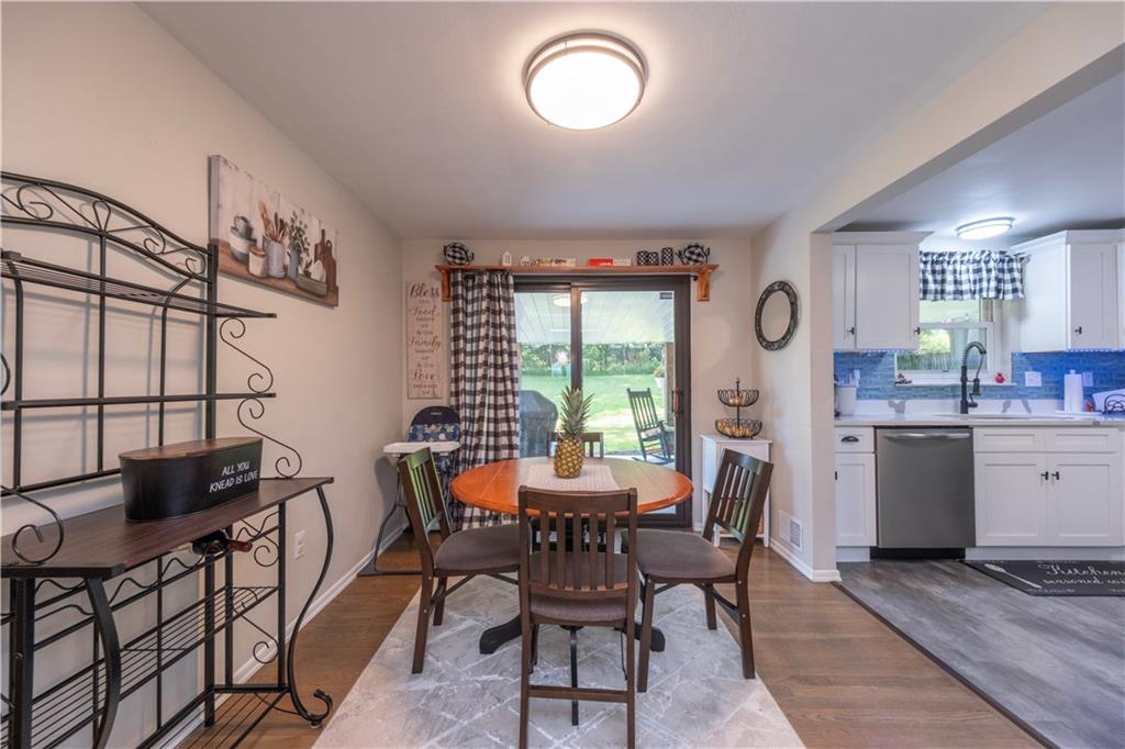 325 Clements Road Pittsburgh, PA 15239 - Photo 5 of 28 The living room flows seamlessly to the dining area and kitchen providing an open concept feel