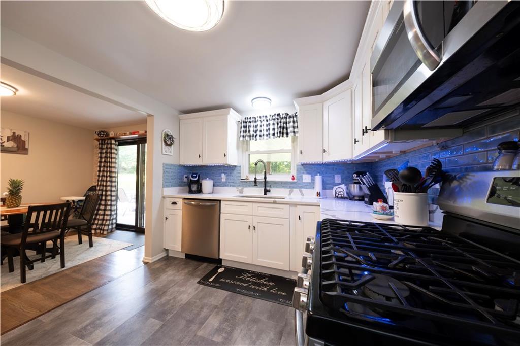 325 Clements Road Pittsburgh, PA 15239 - Photo 9 of 28 There is a gas stove and all appliances are included in the kitchen with a 1 year home warranty