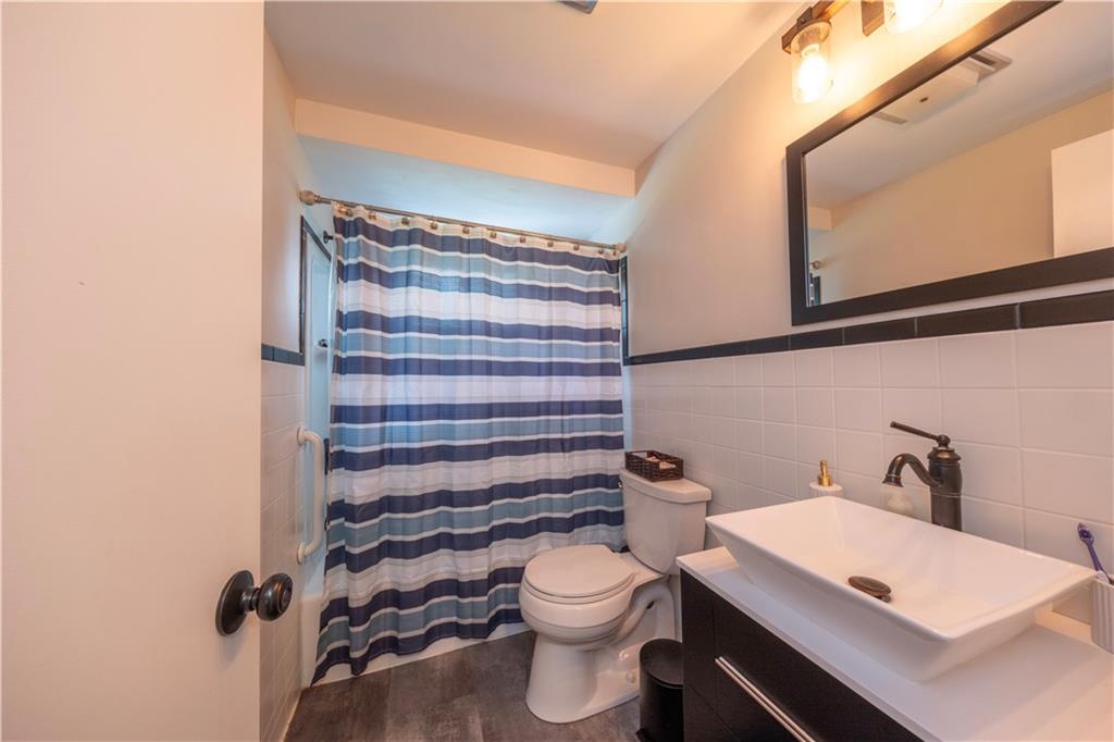 325 Clements Road Pittsburgh, PA 15239 - Photo 10 of 28 The main level full bathroom contains a tub and some modern features giving it an updated feel