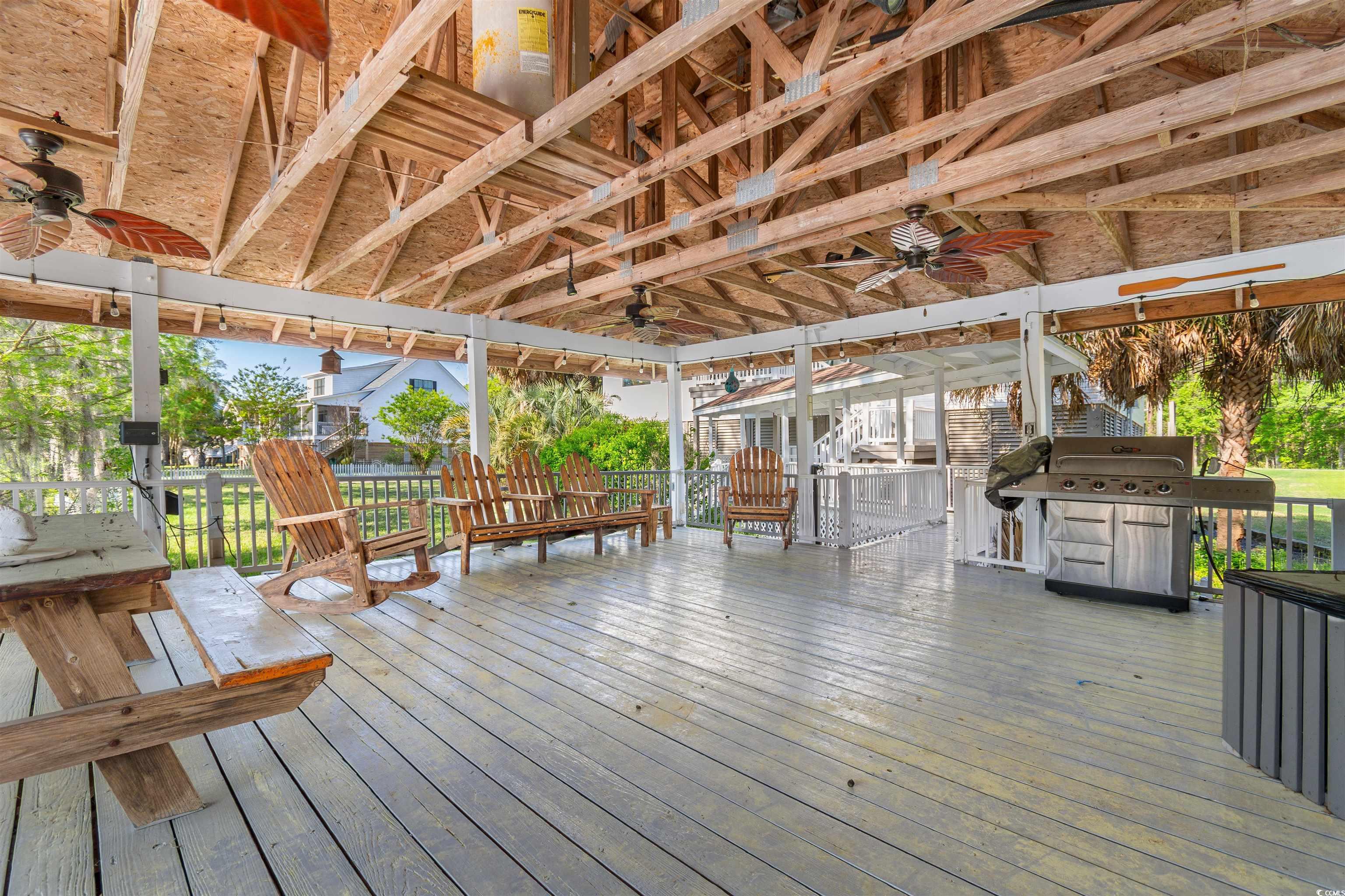 1030 State Rd S-34-319 Mullins, SC 29574 - Photo 8 of 31 Wooden terrace featuring area for grilling and a c