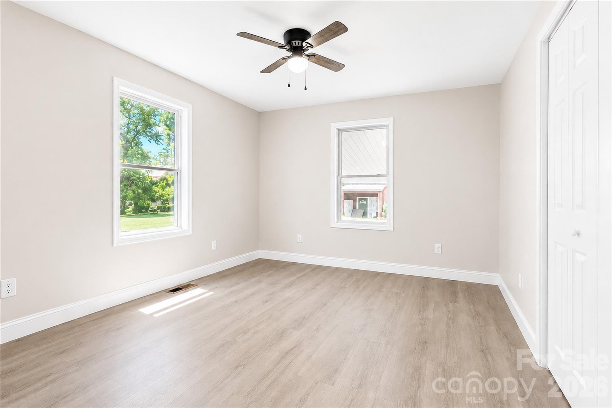 1403 Dudley Shoals Road Granite Falls, NC 28630 - Photo 17 of 34 wooden floor in an empty room with a window
