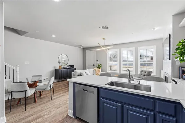 a kitchen with a sink and cabinets