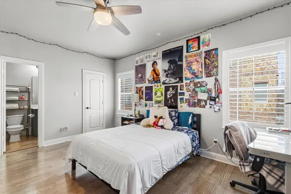 a bed room with a bed and a chair