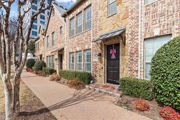a view of a building with potted plants