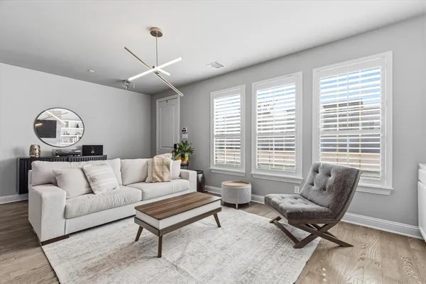 a living room with furniture and a large window