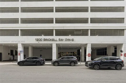a view of a car parked in front of a building