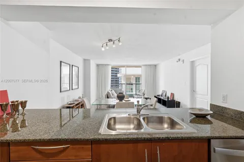 a bathroom with sink granite and a vanity