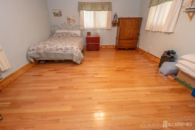 a bedroom with a bed and a cabinets