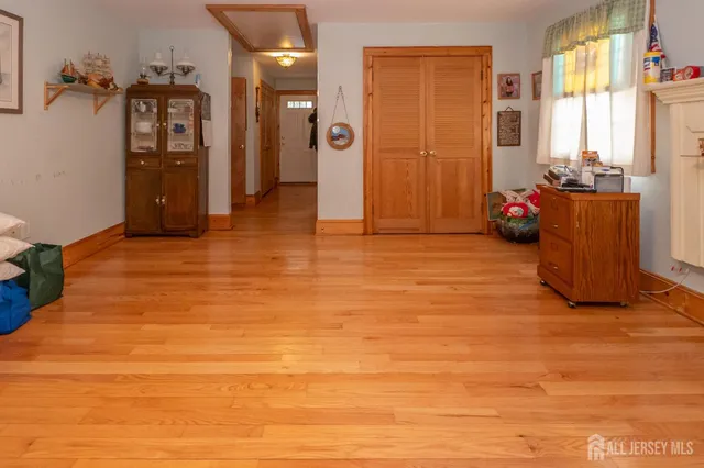 a view of a livingroom with furniture and cabinet