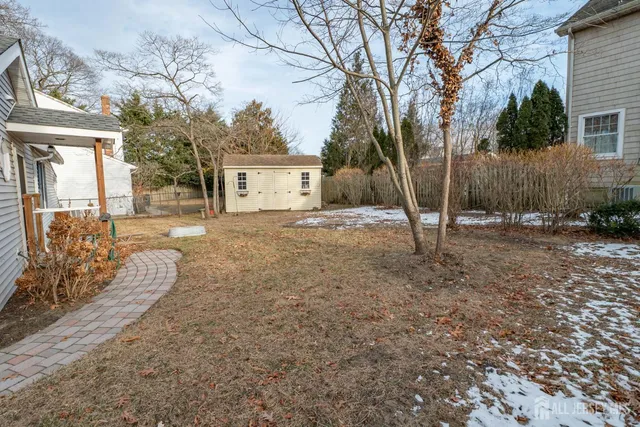 a view of a yard and a house
