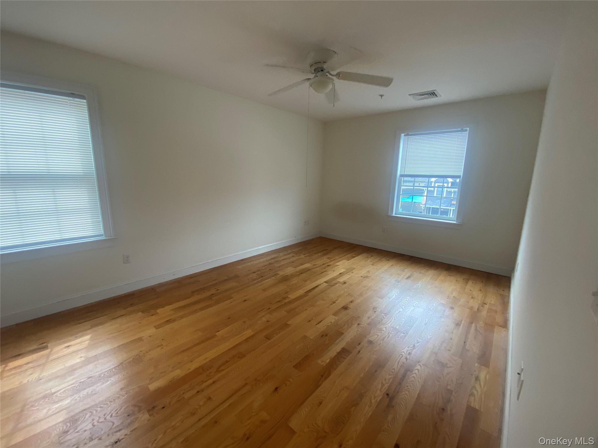 27 North Main Street Florida, NY 10921 - Photo 9 of 20 Unfurnished room featuring light wood finished floors and ceiling fan
