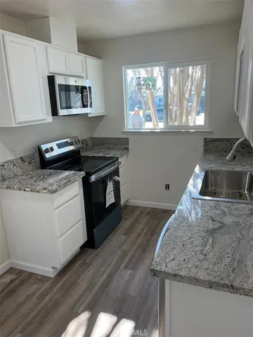 a kitchen with a stove and a sink