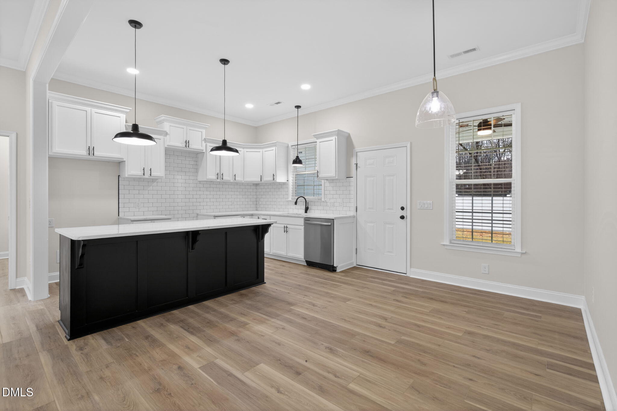 2126 Fieldcrest Road East Wilson, NC 27893 - Photo 14 of 40 a large kitchen with a large counter top a sink stainless steel appliances and cabinets