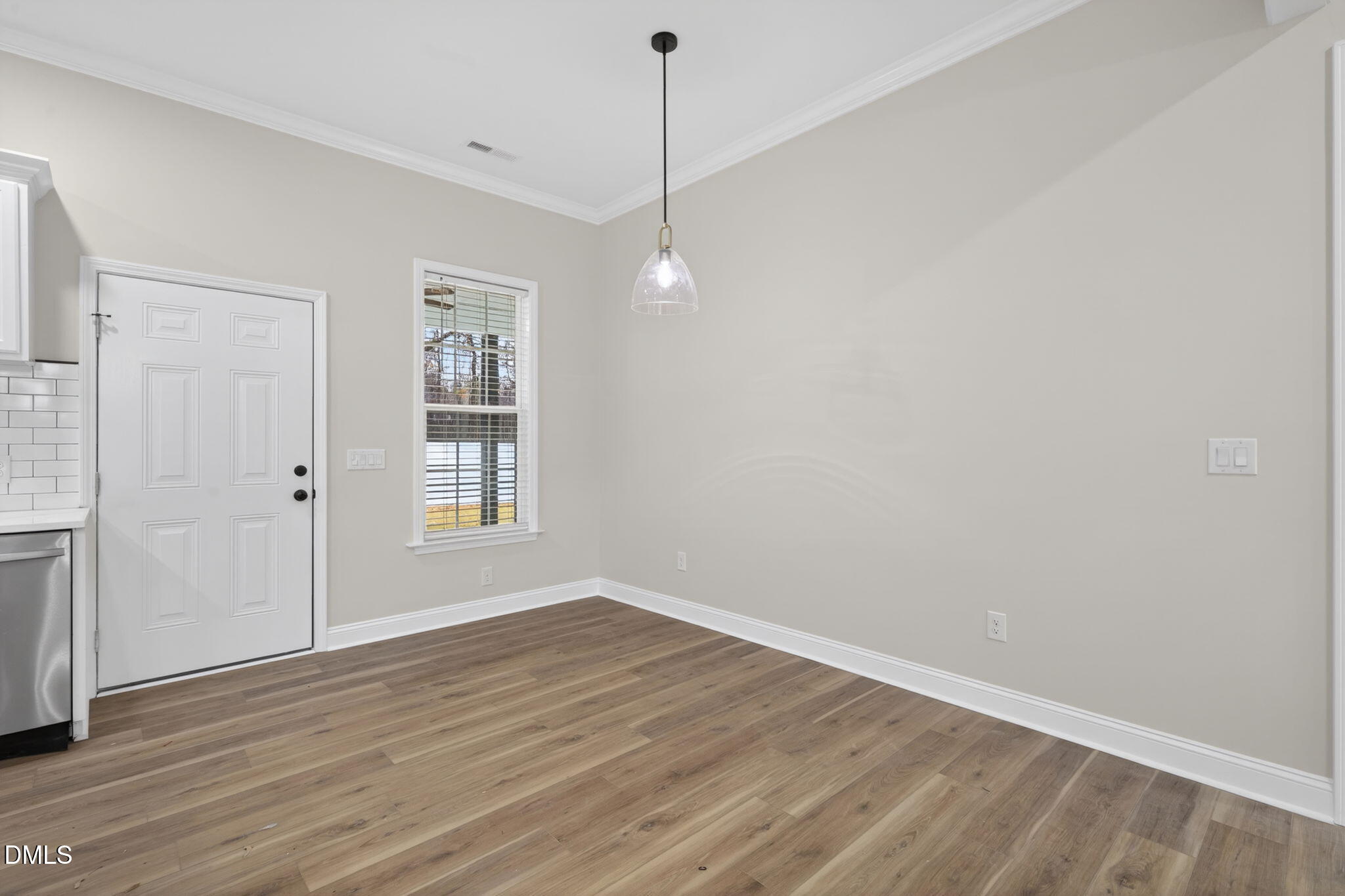 2126 Fieldcrest Road East Wilson, NC 27893 - Photo 15 of 40 a view of a room with wooden floor and windows