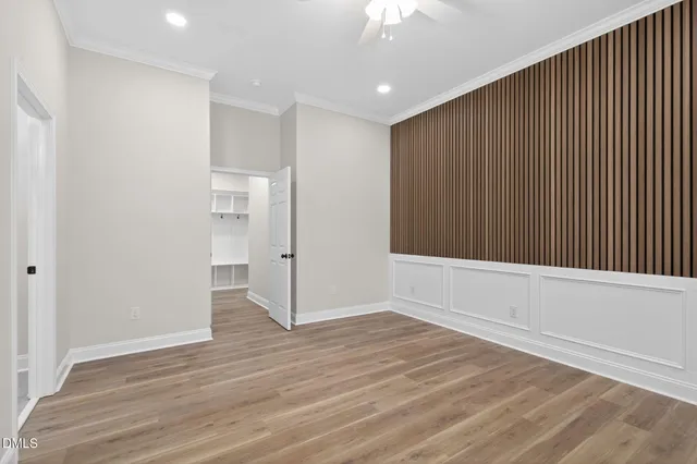 an empty room with wooden floor