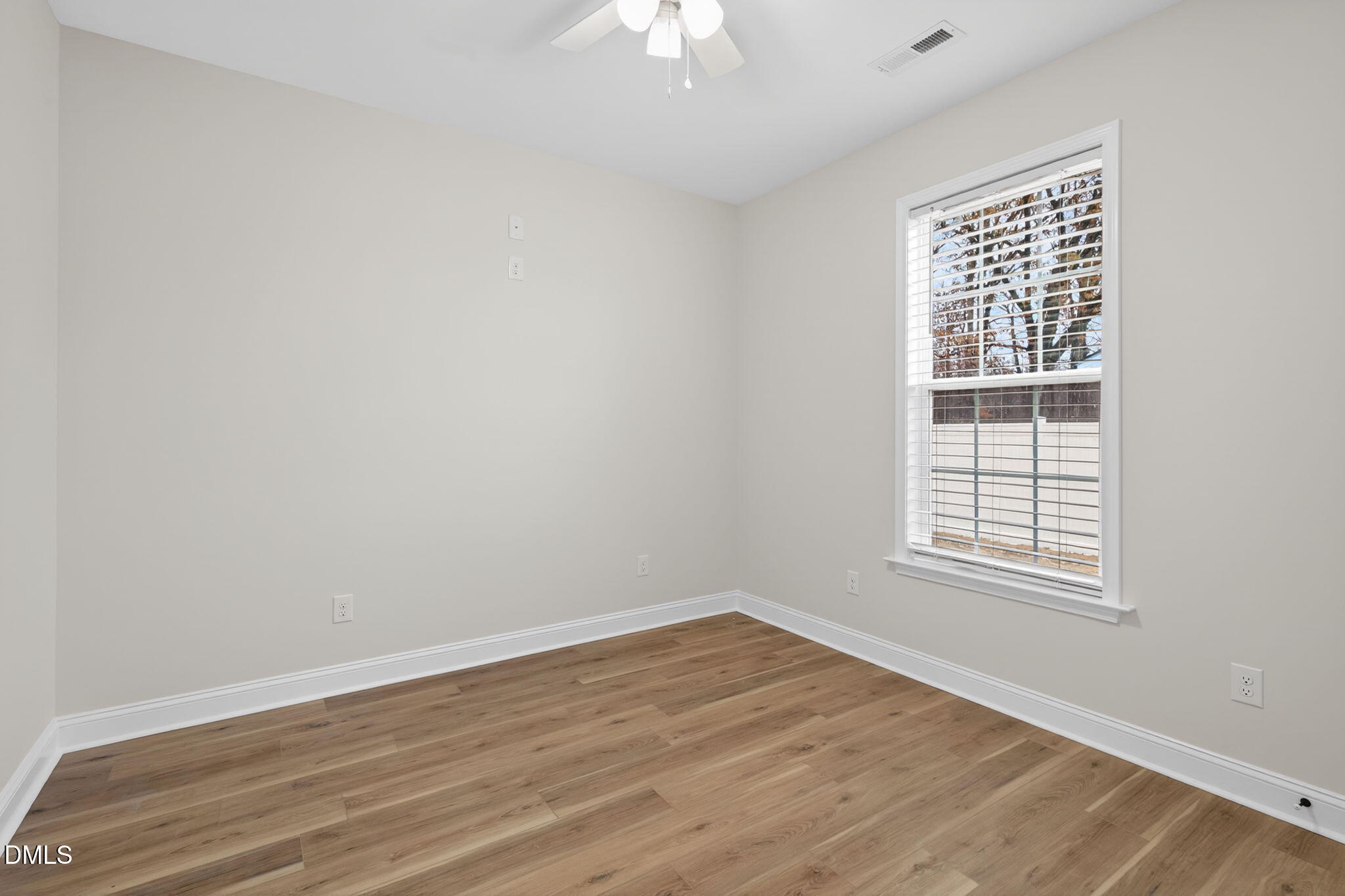 2126 Fieldcrest Road East Wilson, NC 27893 - Photo 28 of 40 wooden floor in an empty room with a window