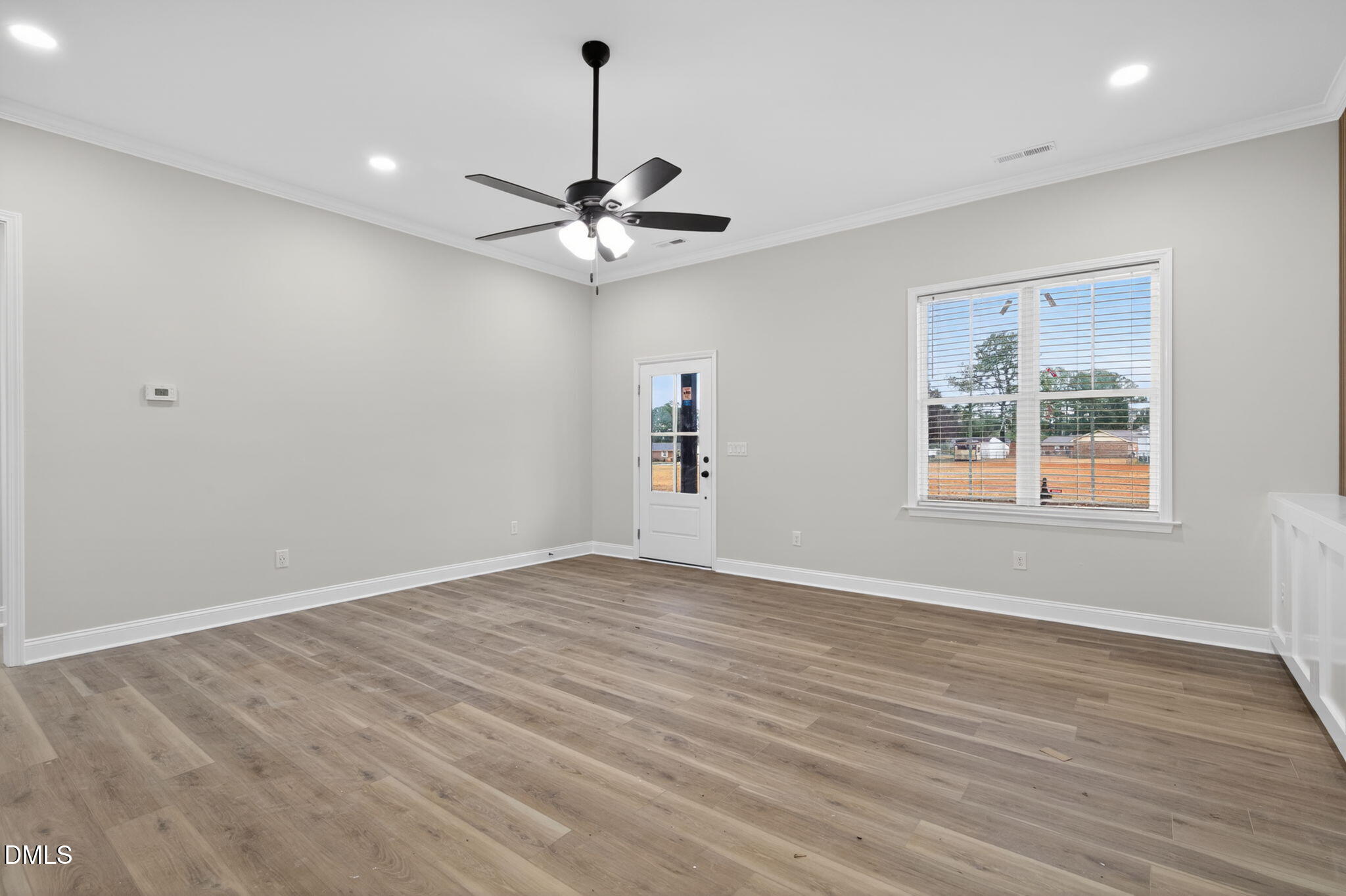 2126 Fieldcrest Road East Wilson, NC 27893 - Photo 31 of 40 a view of an empty room with window and wooden floor