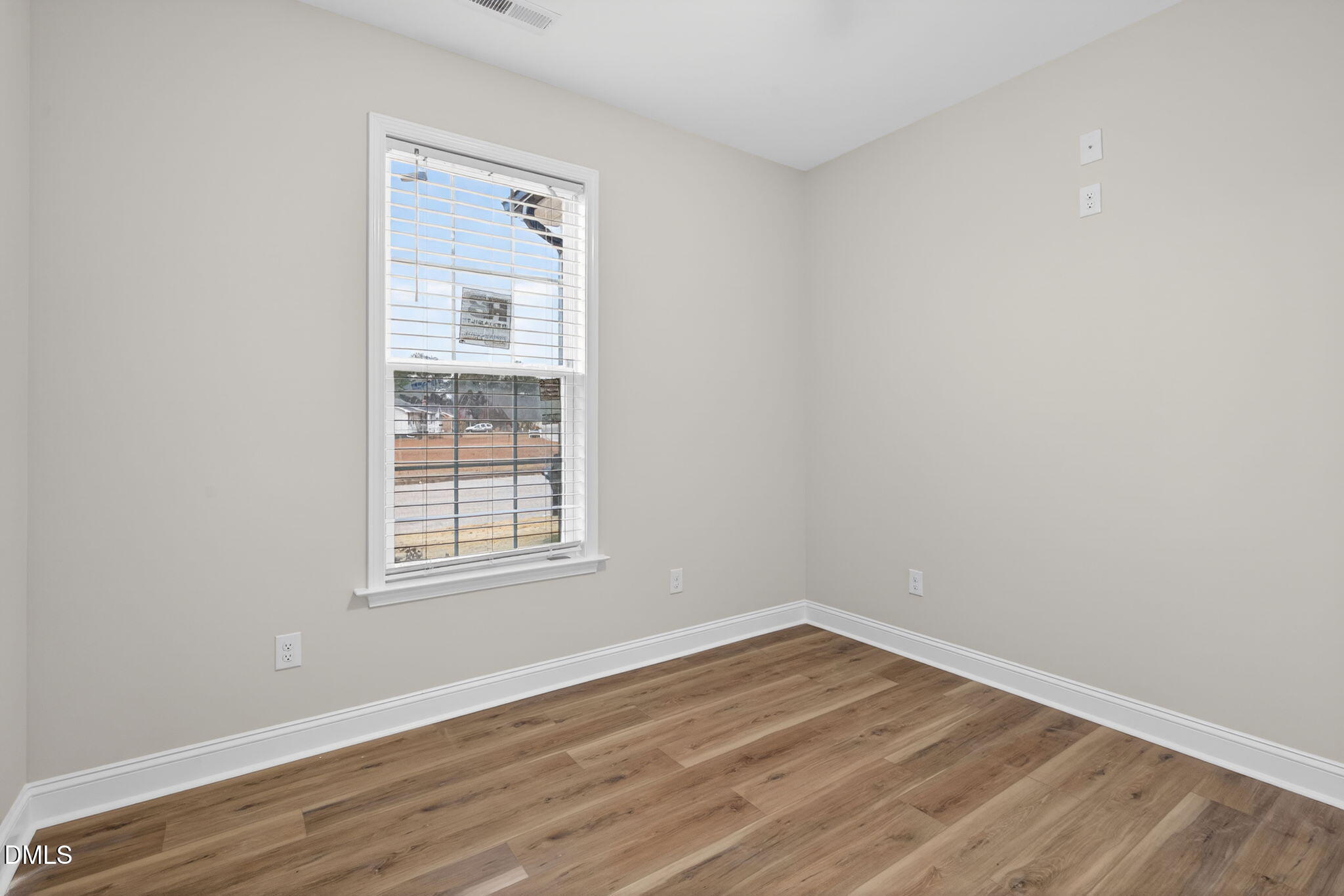 2126 Fieldcrest Road East Wilson, NC 27893 - Photo 32 of 40 an empty room with wooden floor and windows