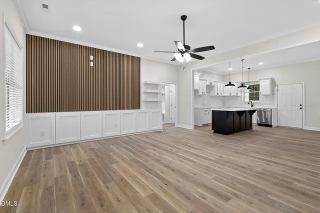a view of a kitchen with a sink and a kitchen view