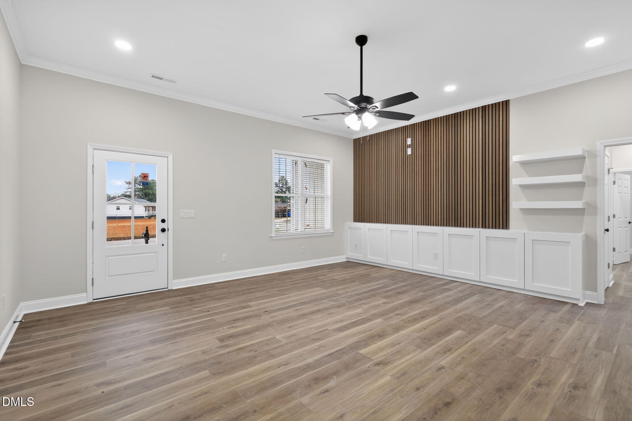 2126 Fieldcrest Road East Wilson, NC 27893 - Photo 6 of 40 a view of an empty room with window and wooden floor