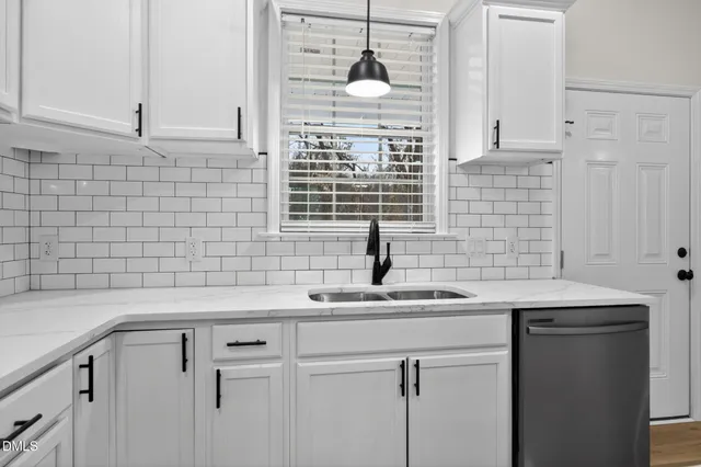 a kitchen with a sink and a window