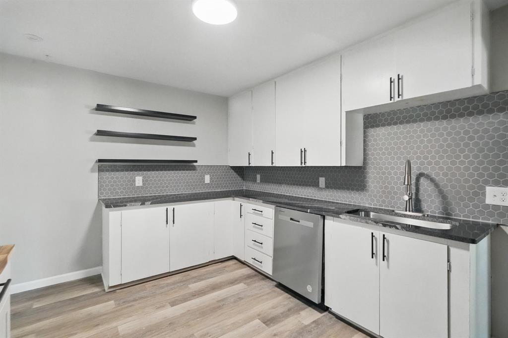 2781 Beech Street, Unit A & B Abilene, TX 79601 - Photo 11 of 35 a kitchen with granite countertop white cabinets and white appliances