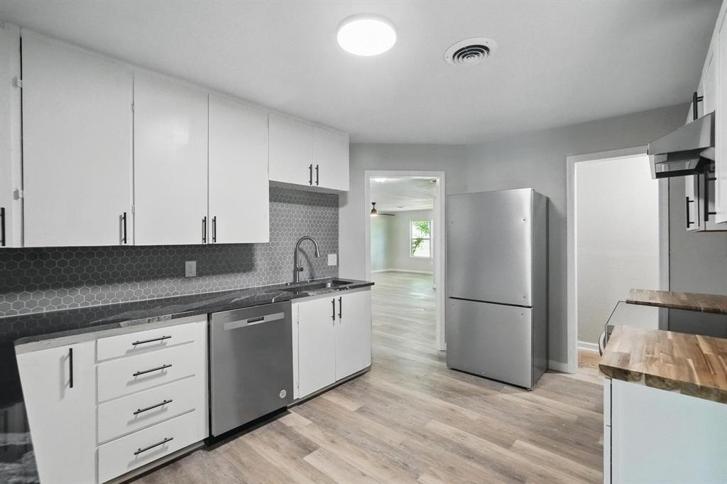 2781 Beech Street, Unit A & B Abilene, TX 79601 - Photo 12 of 35 a kitchen with a refrigerator and white cabinets