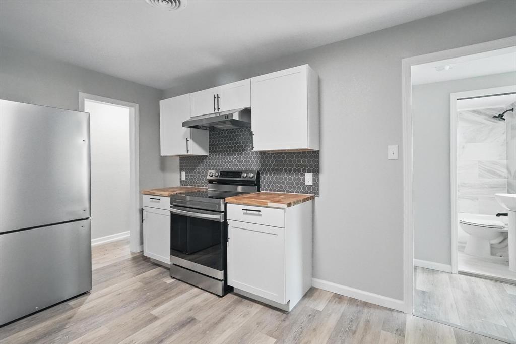 2781 Beech Street, Unit A & B Abilene, TX 79601 - Photo 13 of 35 a kitchen with stainless steel appliances a refrigerator stove and sink