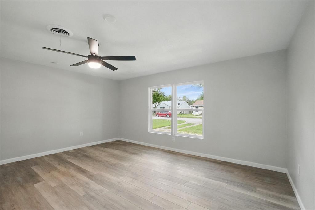2781 Beech Street, Unit A & B Abilene, TX 79601 - Photo 20 of 35 an empty room with window and ceiling fan