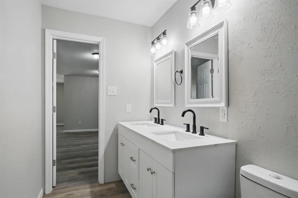 2781 Beech Street, Unit A & B Abilene, TX 79601 - Photo 24 of 35 a bathroom with a sink a toilet and shower