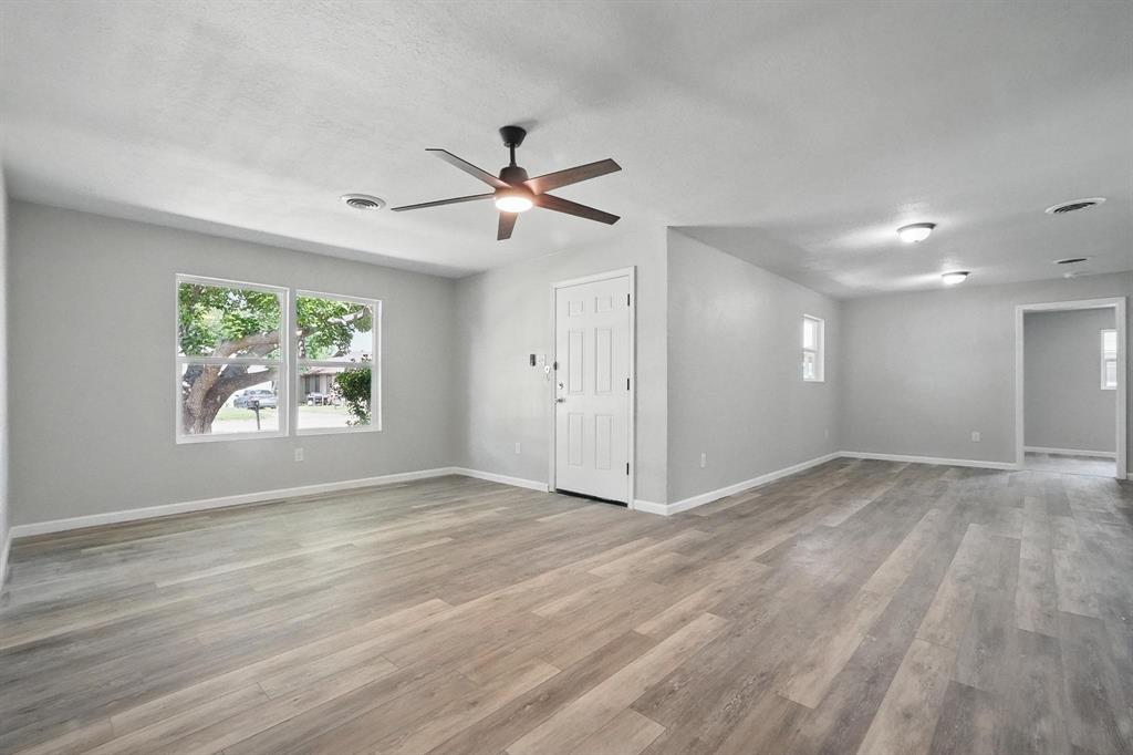 2781 Beech Street, Unit A & B Abilene, TX 79601 - Photo 4 of 35 a view of an empty room with a window and wooden floor