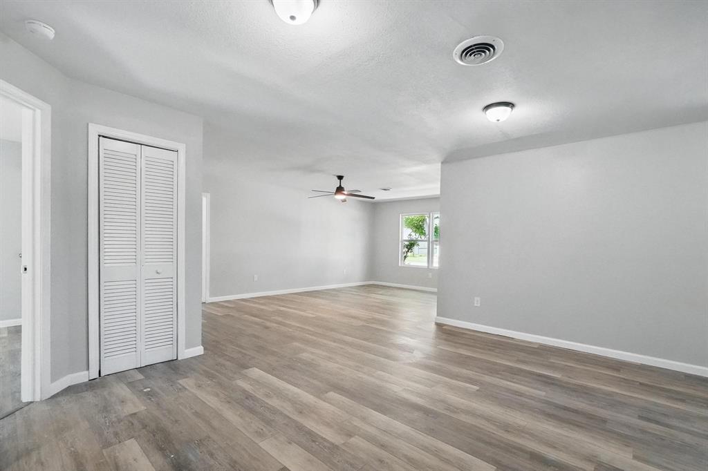 2781 Beech Street, Unit A & B Abilene, TX 79601 - Photo 9 of 35 an empty room with wooden floor and windows