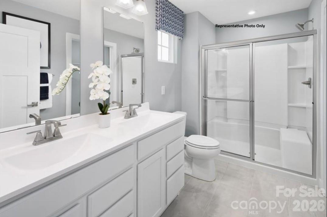 214 Maggys Way Pageland, SC 29728 - Photo 6 of 13 a bathroom with a toilet sink and shower