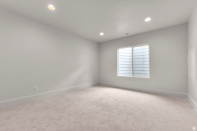 11718 South Halls Crk Road Draper, UT 84020 - Photo 22 of 28 Spare room with light colored carpet and recessed lighting