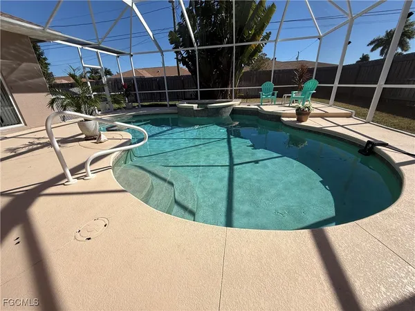 a view of a swimming pool with a patio