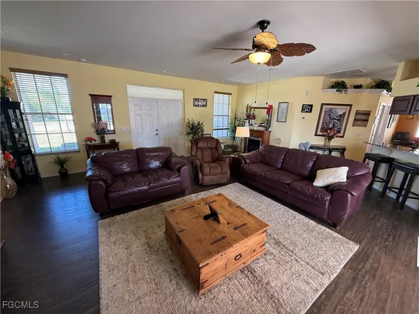 a living room with furniture rug and window