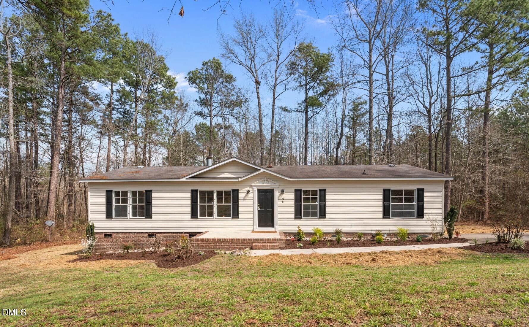 35 Athens Court Cameron, NC 28326 - Photo 1 of 44 front view of a house with a yard