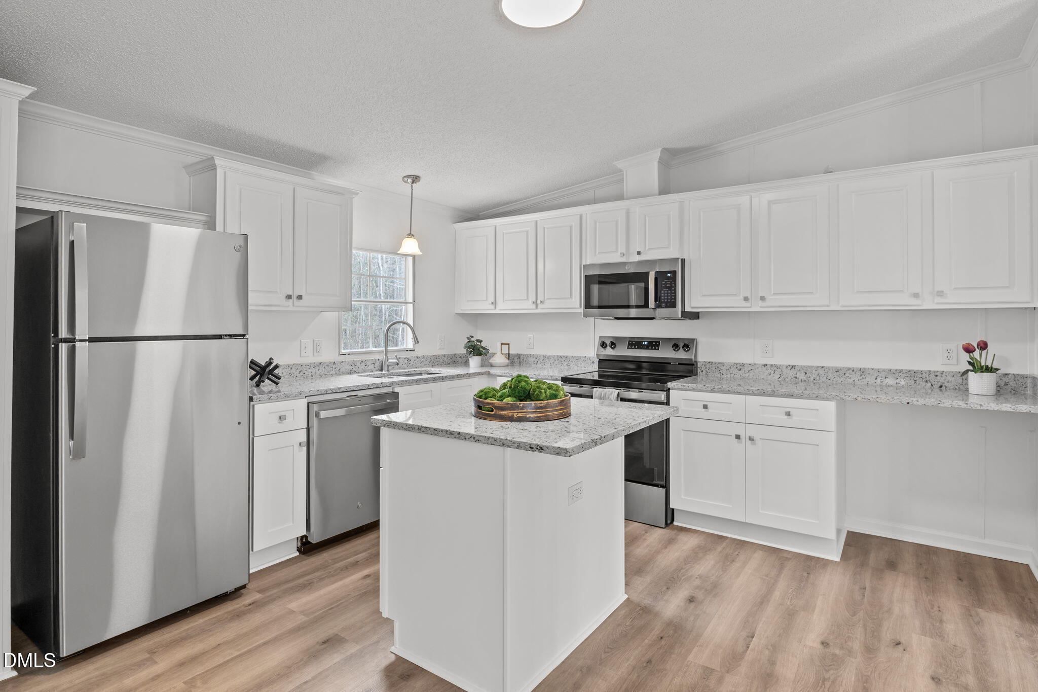 35 Athens Court Cameron, NC 28326 - Photo 12 of 44 a kitchen with white cabinets and stainless steel appliances