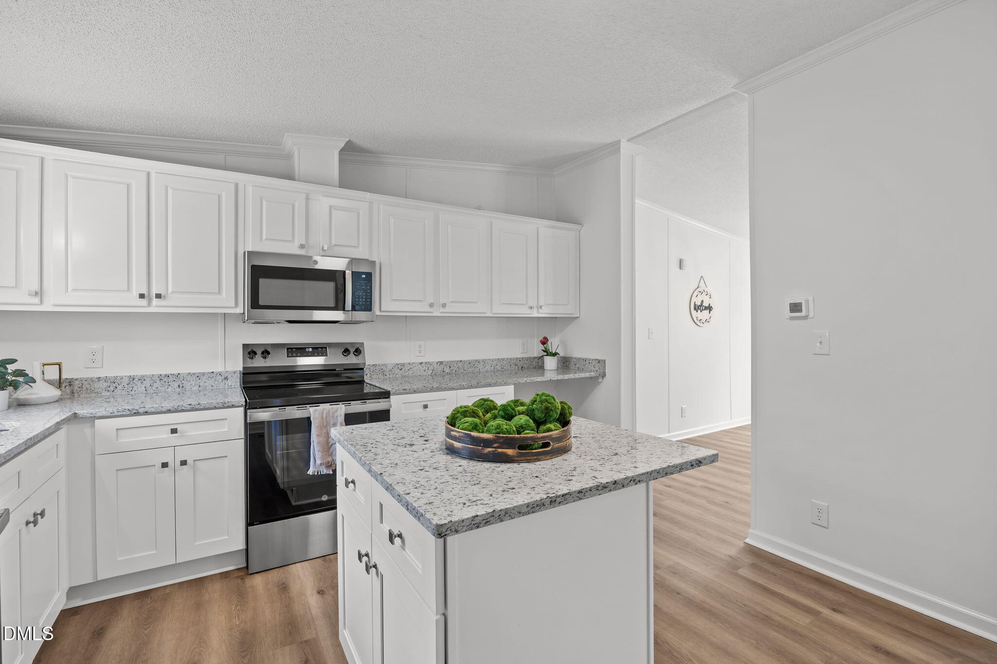 35 Athens Court Cameron, NC 28326 - Photo 14 of 44 a kitchen with granite countertop white cabinets and white appliances