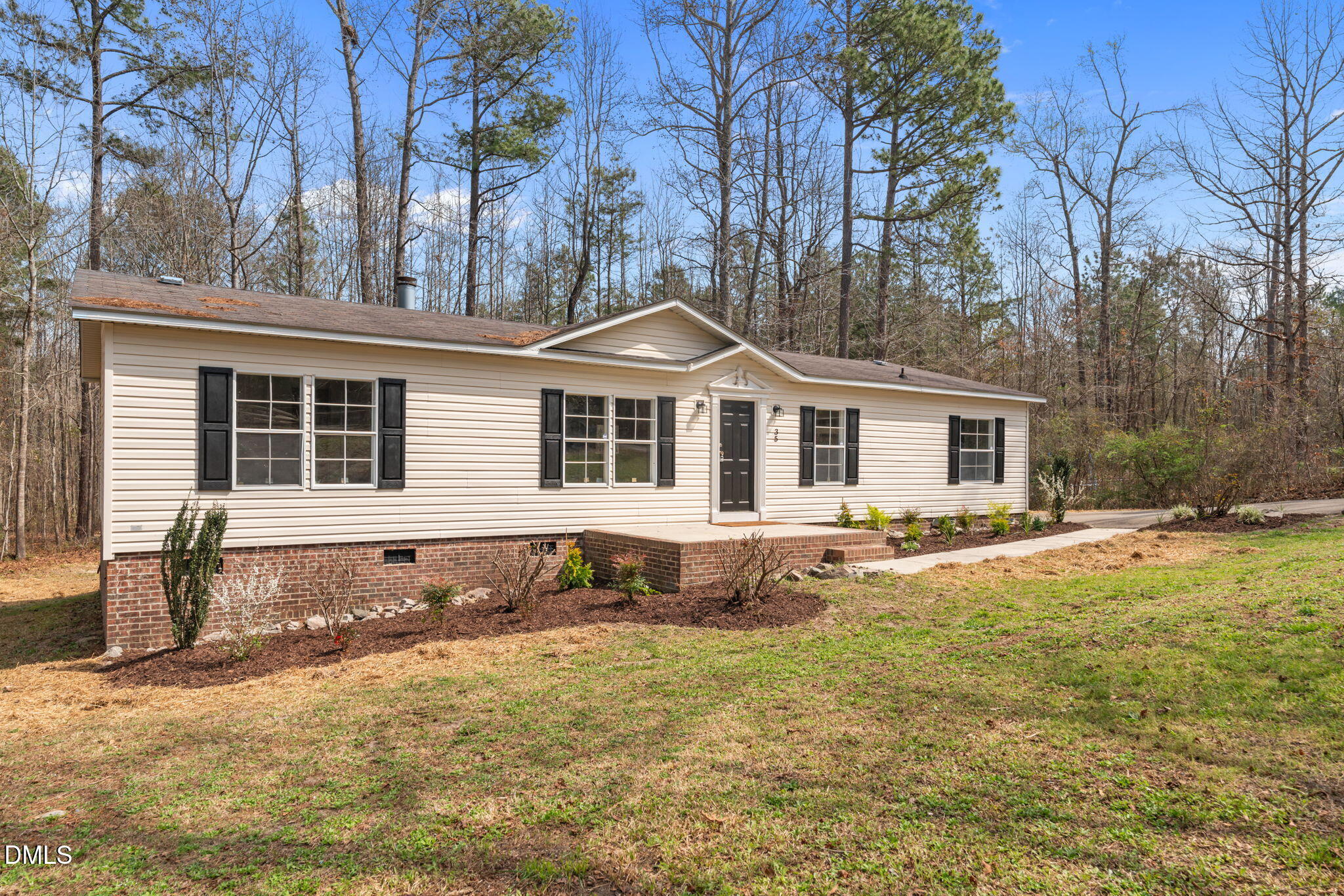 35 Athens Court Cameron, NC 28326 - Photo 2 of 44 a front view of a house with a yard