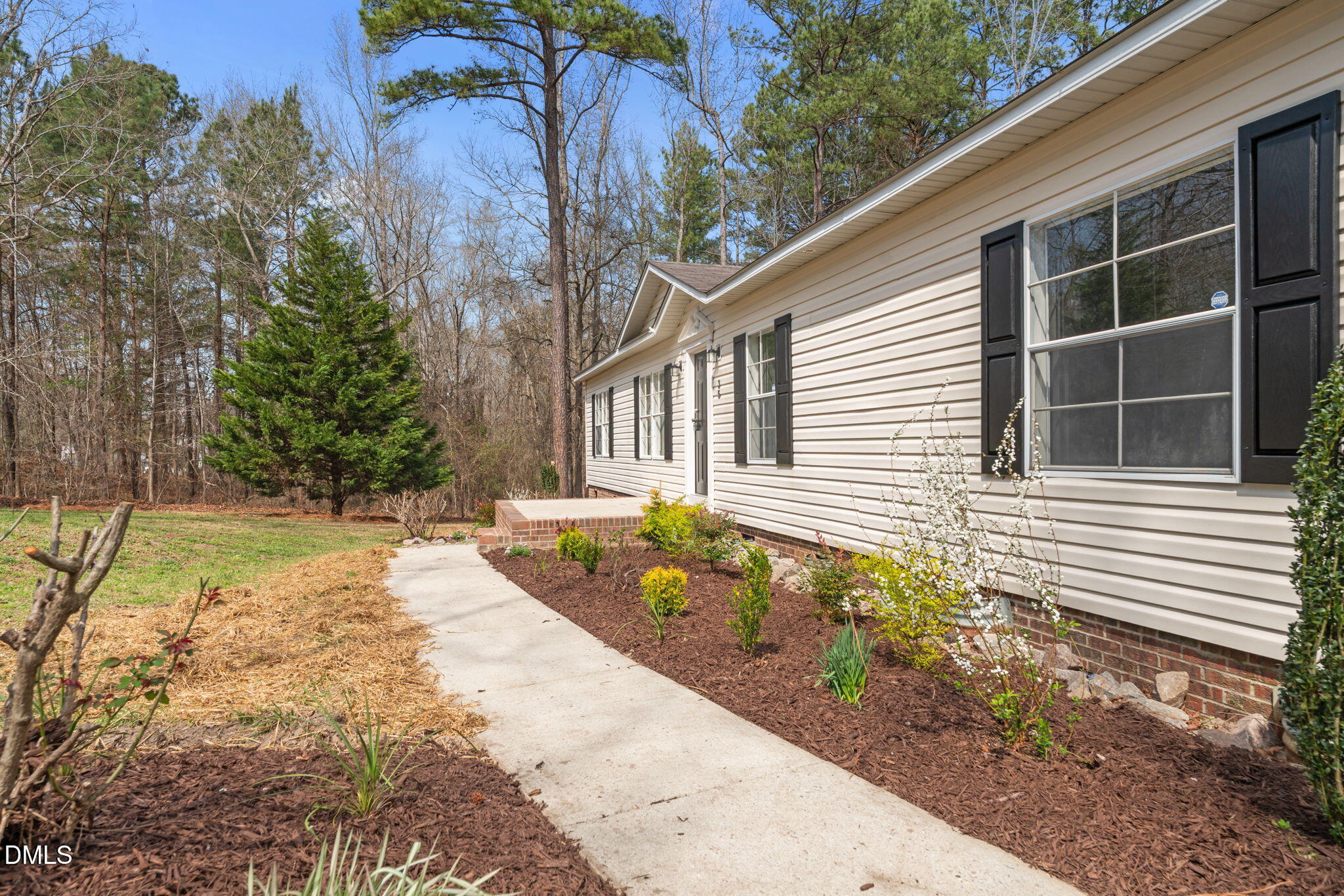 35 Athens Court Cameron, NC 28326 - Photo 4 of 44 a house with garden in front of it